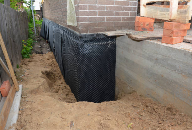 Happy homeowners after waterproofing job in Cato